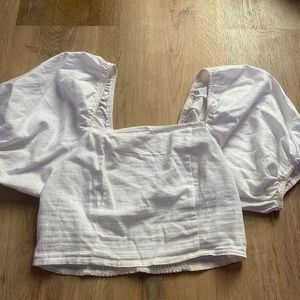 This is an adorable puff sleeve white cropped top from cotton on. Adorable fit.